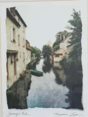 Framed art print titled "Journey's End" by Maureen Love, depicting a scenic canal with buildings and a small boat.
