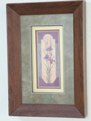 Framed floral art print featuring purple irises, presented in a multi-layered mat and a wide, dark wood-grain frame.