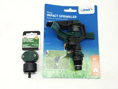 Orbit plastic impact sprinkler head and an Ace female hose repair connector, both in original packaging.