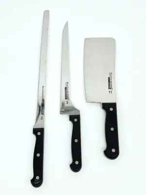 Three Showtime Six Star stainless steel kitchen knives, including a carving knife, a large fillet knife, and a cleaver, all featuring...