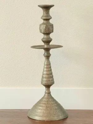 Vintage Middle Eastern or Indian etched brass candlestick holder, featuring intricate hand-engraved patterns and a flared base.