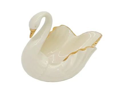 Vintage Lenox porcelain swan dish with gold-gilded trim and beak, featuring a glossy ivory finish.