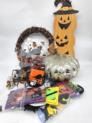 Assortment of Halloween decorations and crafts, including a mercury glass pumpkin, a wooden pumpkin stack, a grapevine wreath with...