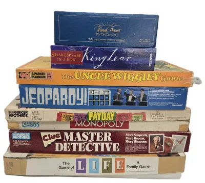Stack of vintage board games including Trivial Pursuit, Shakespeare in a Box: King Lear, The Uncle Wiggily Game, Jeopardy!, Payday,...