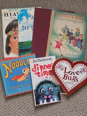 Collection of vintage and modern children's books, including "Pinocchio" illustrated by Lois Lenski, "Dinner...