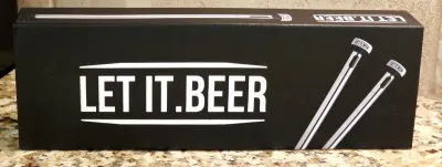 Let It Beer chiller sticks in their original black packaging, designed to keep bottled beer cold.