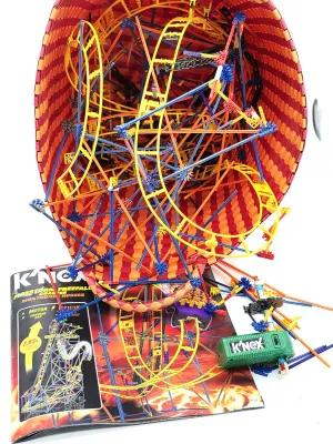 Vintage K'Nex Firestorm Freefall Coaster set, partially assembled inside a woven basket, complete with the original instruction...
