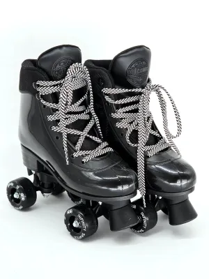 Pair of Gold Medal black quad roller skates with black-and-white patterned laces and Infinity Skates wheels, showing minimal wear.