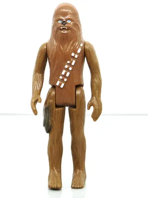 Vintage  Star Wars Chewbacca action figure, circa 1977, featuring molded brown plastic with painted bandolier details.