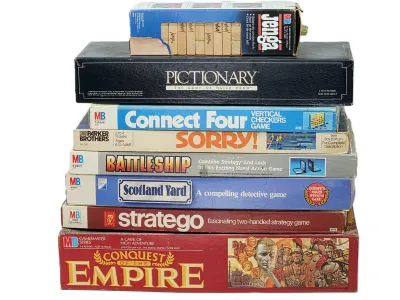 Stack of vintage board games including Conquest of the Empire, Stratego, Scotland Yard, Battleship, Sorry!, Connect Four, Pictionary, and...