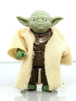 Vintage Star Wars Yoda action figure with original fabric robe, circa 1980.