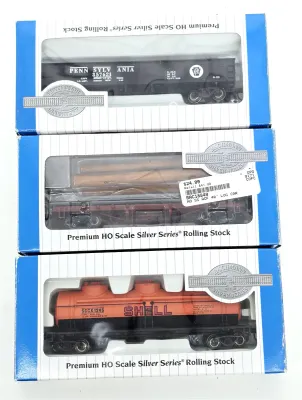 Three Bachmann Premium HO Scale Silver Series rolling stock model train cars in their original boxes, including a Pennsylvania gondola,...