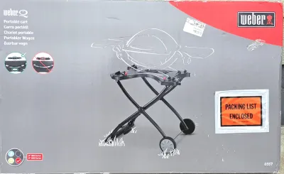 Weber Q portable cart model 6557, new in its original box with packing list enclosed.