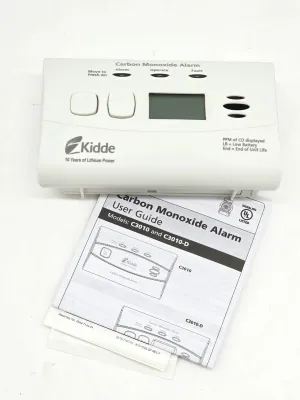 Kidde carbon monoxide alarm, model C3010, with digital display and original user guide.