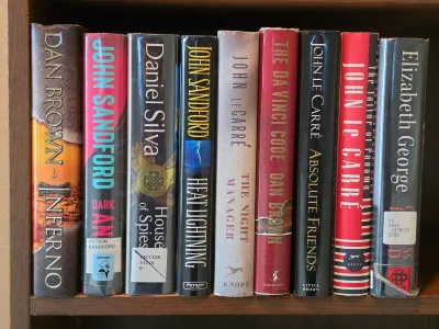 Collection of nine hardcover thriller and mystery novels, including titles by Dan Brown, John Sandford, Daniel Silva, John le Carré, and...