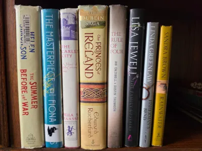 Collection of eight hardcover and paperback fiction books, including titles by Helen Simonson, Edward Rutherfurd, and Lisa Jewell,...