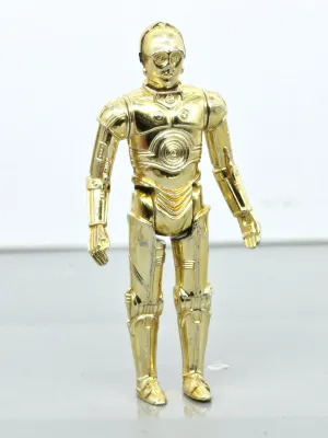 Vintage Star Wars C-3PO action figure with a gold chrome finish, showing minor wear from play.