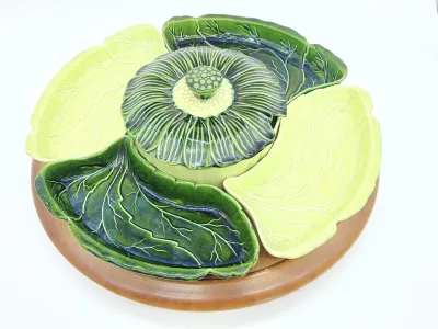 Vintage ceramic cabbage leaf lazy Susan serving set, featuring alternating light and dark green leaf dishes and a central lidded bowl on...
