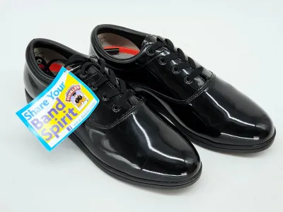 Pair of Dinkles black patent leather marching band shoes, unused with original tag attached.