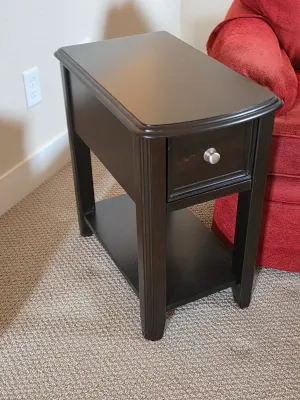 Contemporary dark espresso-finished wooden side table featuring a single drawer with a brushed nickel knob and a lower open shelf.