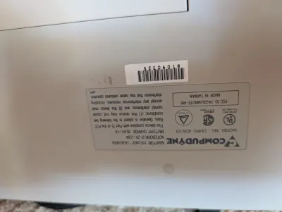 Compudyne model CMPD 4DX/33 notebook computer underside label, showing specifications and FCC ID FKGSLIMNOTE-486, made in Taiwan.