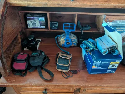 Assorted vintage cameras and camcorders, including a Sony Handycam DCR-HC52 with its original box, a boxed Nikon One-Touch Zoom 70 QD,...