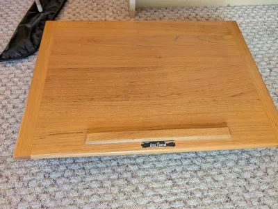 InStand wooden laptop or book stand with a natural oak finish and a raised bottom lip.
