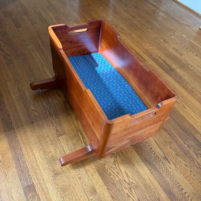 Wooden Rocking Doll Cradle with Carved Walrus Detail