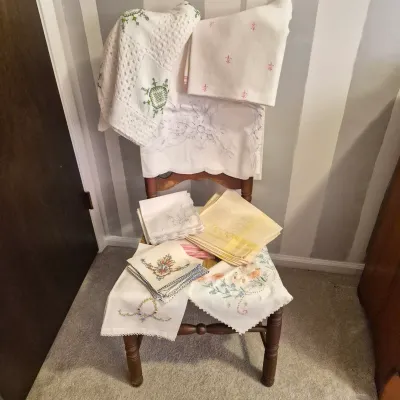 LOT 16X: Ladder-Back Rush Seat Chair with Collection of Vintage Linens