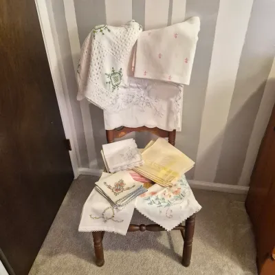 LOT 16X: Ladder-Back Rush Seat Chair with Collection of Vintage Linens