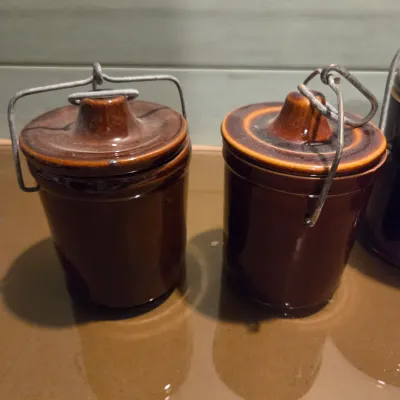 Sale Photo Thumbnail #435: 6 Cheese Crocks with lids and latches. On is missing the latch piece