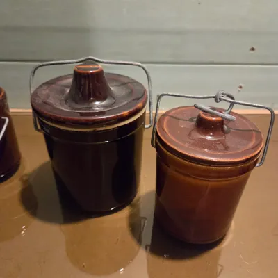 Sale Photo Thumbnail #437: 6 Cheese Crocks with lids and latches. On is missing the latch piece