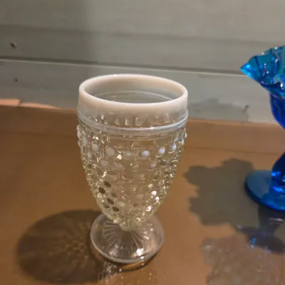 Sale Photo Thumbnail #336: Old Black satin advertising piece, moonstone goblet, Fenton french opalescent vase and a gorgeous turquoise Fenton Thumbprint Compote