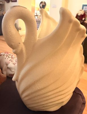 Sale Photo Thumbnail #7: Vintage off-white ceramic swan planter featuring a textured, matte finish and stylized feather details.
