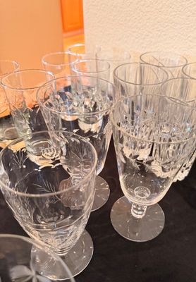 Sale Photo Thumbnail #6: Collection of vintage cut crystal stemware and tumblers featuring delicate floral and geometric patterns.