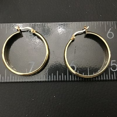 Sale Photo Thumbnail #72: Pair of gold-tone hoop earrings featuring latch-back closures. Marked '925' indicating sterling silver construction with a gold-plated or vermeil finish. Each earring measures approximately 1 inch in diameter. In good pre-owned condition with light surfac