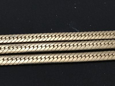 Sale Photo Thumbnail #266: Gold-tone triple-strand herringbone pattern chain bracelet. Features a fold-over clasp mechanism. Measures approximately 7 to 7.5 inches long. Excellent vintage condition with minimal surface wear.
