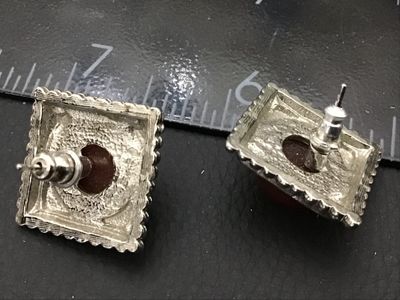 Sale Photo Thumbnail #168: Pair of square silver-tone pierce/post stud earrings featuring round, domed reddish-brown cabochons set in a square frame with beaded trim. Showing minimal wear, overall good condition.