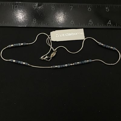 Sale Photo Thumbnail #73: New with tags Liz Claiborne silver-tone snake chain necklace featuring blue speckled stone or glass beads and silver-tone spacer accents. Measures approximately 16 inches in length with a lobster claw clasp and Liz Claiborne metal hang tag. Original retai