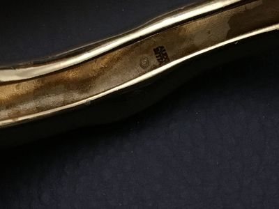 Sale Photo Thumbnail #224: Alexis Bittar gold-tone designer bangle bracelet featuring an organic, undulating sculptural design. Stamped with the Alexis Bittar maker's mark on the interior.   Excellent Condition
