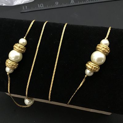 Sale Photo Thumbnail #96: Long vintage opera-length station necklace featuring a gold-tone snake chain interspersed with clusters of faux pearl beads and textured, gold-tone accent spacers. Good condition with light vintage wear. Perfect for layering or wearing single/double wrapp