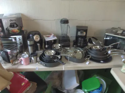 Sale Photo Thumbnail #3: Collection of kitchen appliances and cookware, including a Vitamix blender, Cuisinart coffee maker, air fryer, toaster oven, and Calphalon nonstick pots and pans.