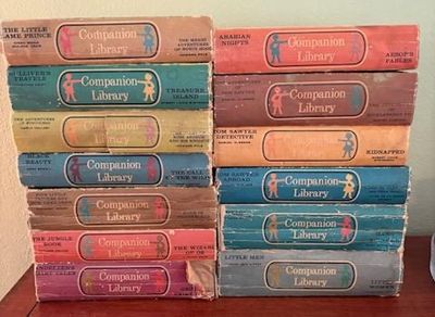 Collection of vintage Companion Library two-in-one classic children's books, showing shelf wear and spine creasing.