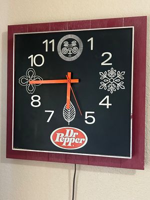 Vintage Dr Pepper square advertising wall clock featuring four seasonal motifs and bright orange hands.