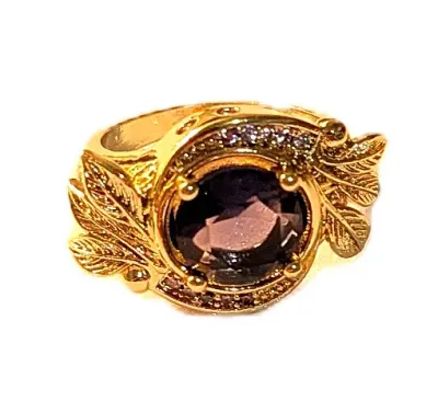 **NEW ARRIVAL** Size 7 PURPLE Round Beveled Stone 4-Prong RING with "Leaves" and Clear Stones Surround on a Gold Tone Band...
