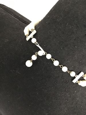 Sale Photo Thumbnail #64: Vintage mid-century double strand costume jewelry necklace featuring opaque white round beads interspersed with faceted clear glass accent beads. Includes an adjustable silver-tone tail chain clasp with bead drop. In good vintage condition with light, age