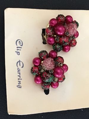 Sale Photo Thumbnail #37: Pair of vintage cluster clip-on earrings featuring vibrant magenta/fuchsia faux pearls, textured pink beads, and dark glittered accents. Set on gold-tone metal clip backs, marked 'HONG KONG'. Presented on original card backing marked 'Clip Earring' and 'M