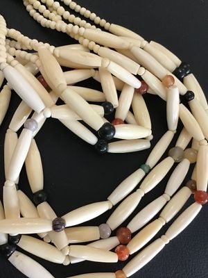 Sale Photo Thumbnail #9: Multi-strand Native American style hairpipe bead necklace featuring off-white smooth bone or horn pipe beads interspersed with colorful polished round stone accents (including agate and jasper colors). Features small seed beads near the secure metal hook 