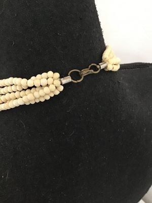 Sale Photo Thumbnail #10: Multi-strand Native American style hairpipe bead necklace featuring off-white smooth bone or horn pipe beads interspersed with colorful polished round stone accents (including agate and jasper colors). Features small seed beads near the secure metal hook 