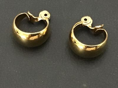 Sale Photo Thumbnail #239: Pair of vintage Monet gold-tone chunky half-hoop/dome clip-on earrings. Marked ©MONET on the clip mechanisms. High-polish finish in good vintage condition